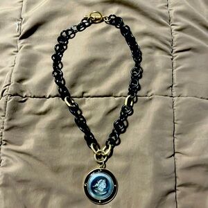 Extasia black & gold Toggle Necklace. Chain is 18”inches, cameo 1 1/5” diameter